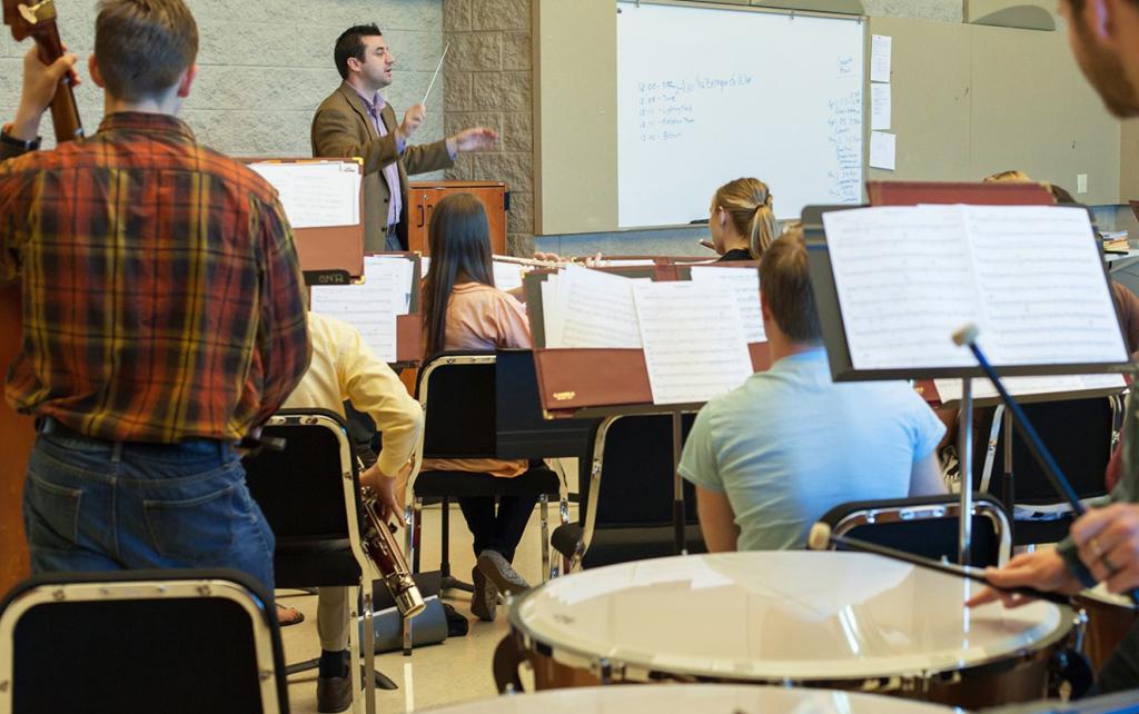 Teacher and students in music class